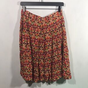 Fall print pleated knee length skirt.